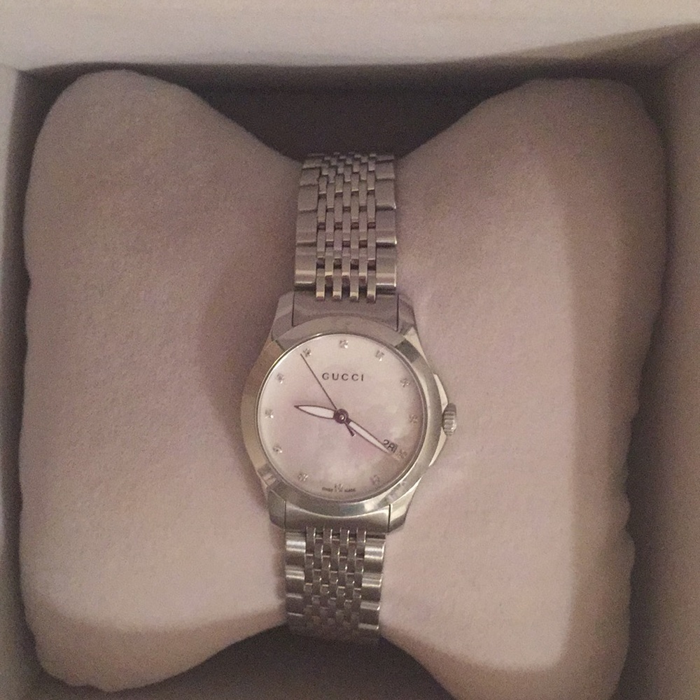 Gucci mother of pearl watch.